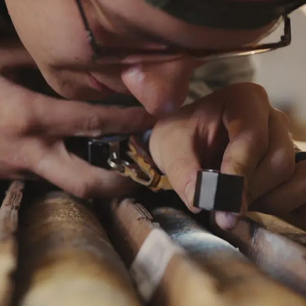 A person inspecting a sample up close